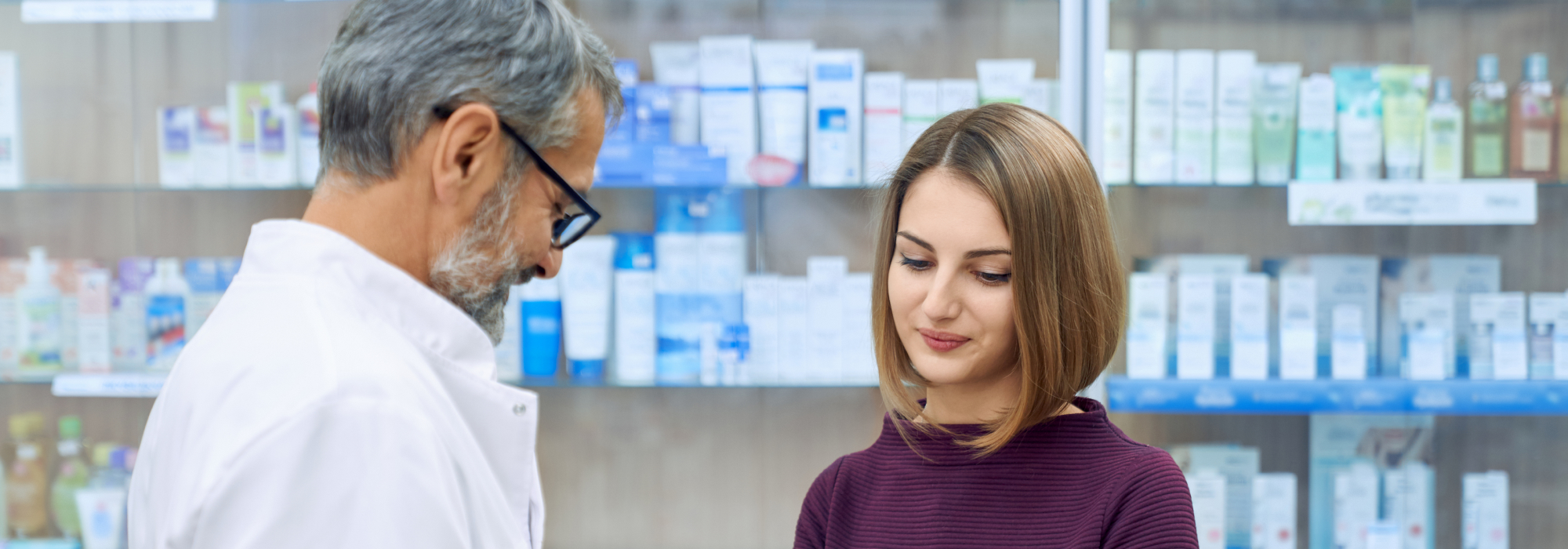pharmacist discussing medication with customer