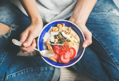 bowl with yogurt, granola, and berries